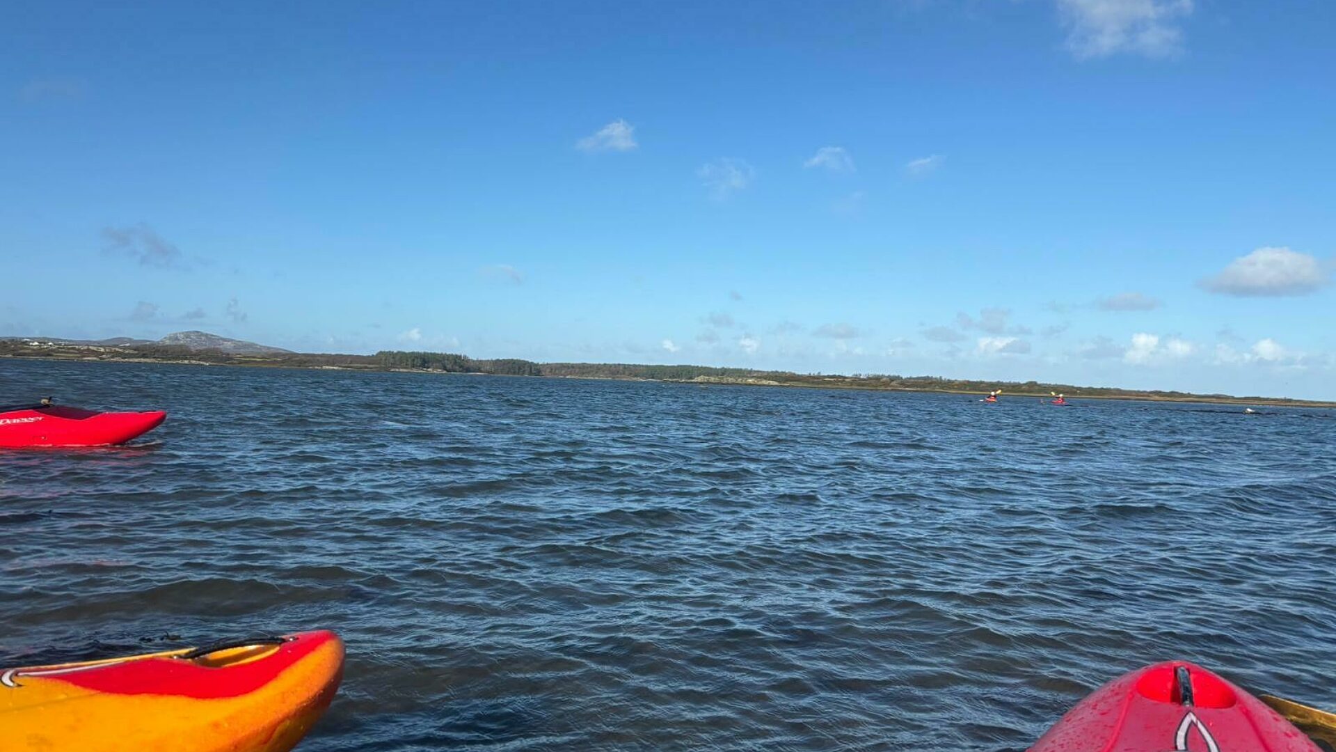 Kayaks on the still river
