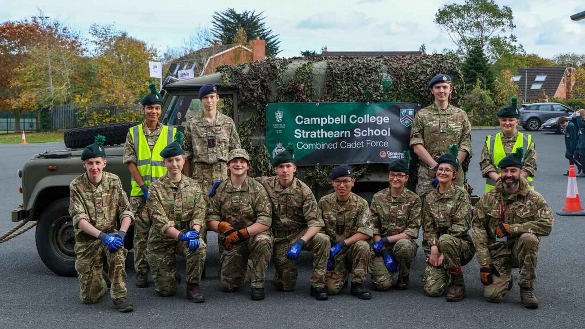 CCF cadets pose in front of Land Rover