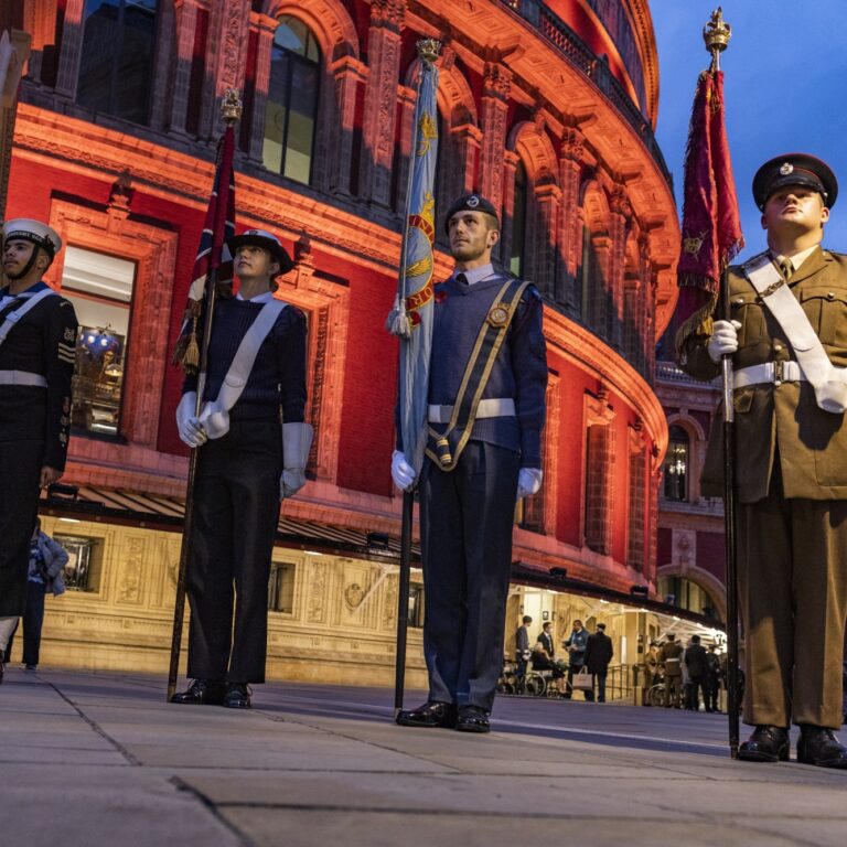 Cadets from Tr-services stand with flags outside the Royal Albert Hall