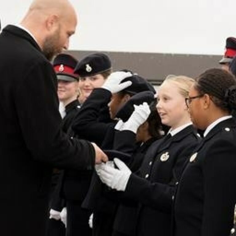 DOYRMS Alex Foreman presenting berets small 1