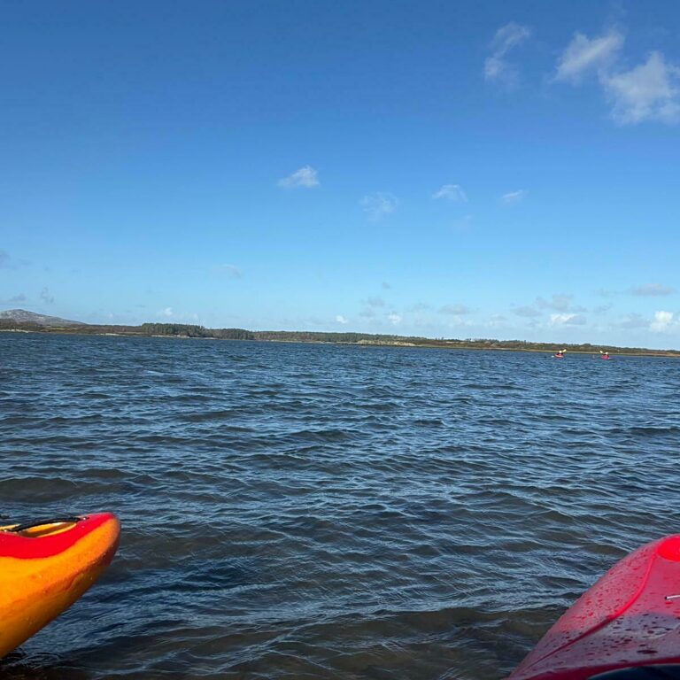 Kayaks on the still river