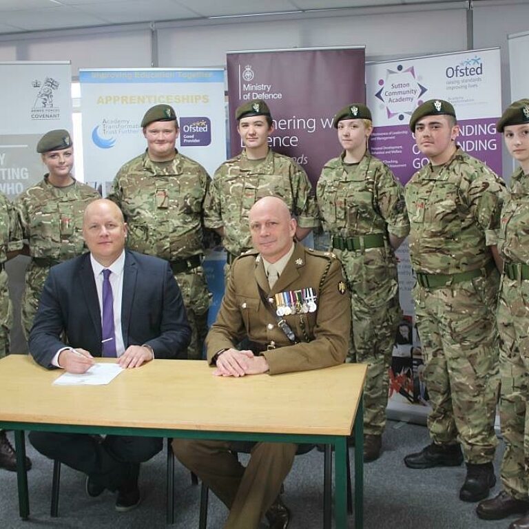 Principal Tim Croft and Lt Col Keith Spiers with cadets from the schools cadet unit 1