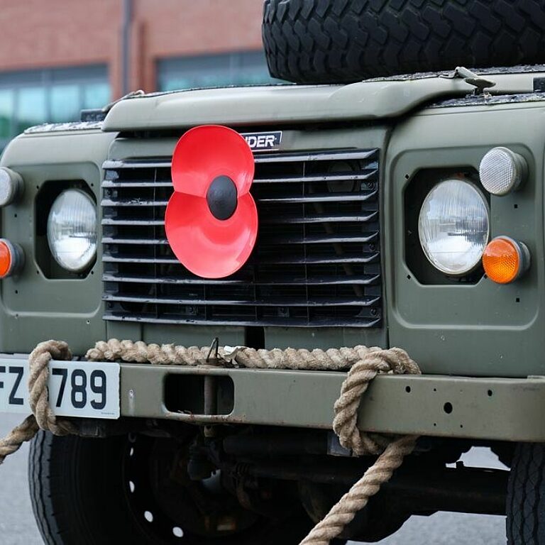 Land Rover with a poppy