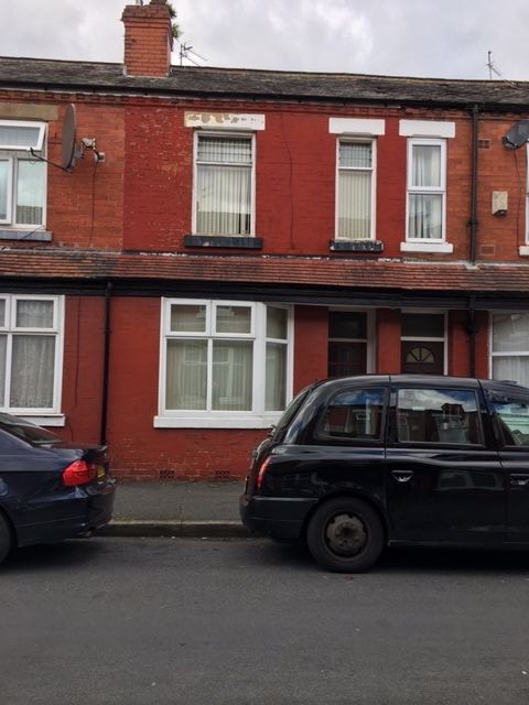 2 bedroom mid terraced house SSTC in Manchester - Photograph 1.