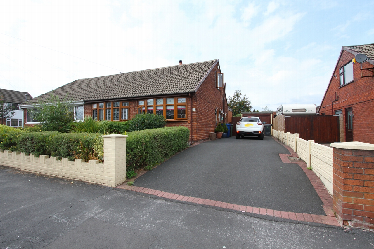 3 bedroom detached bungalow Sold in Wigan - Photograph 1