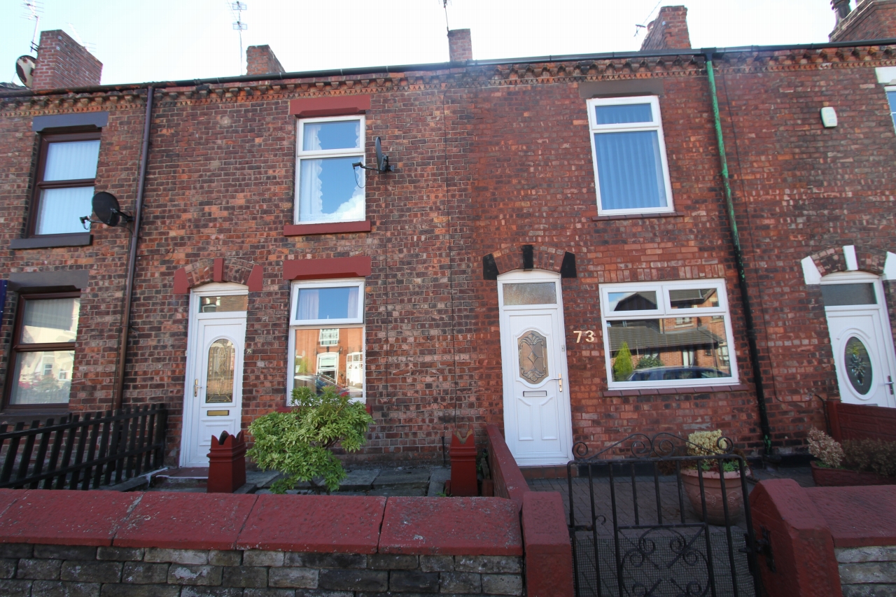 2 bedroom mid terraced house Sold in Wigan - Photograph 1