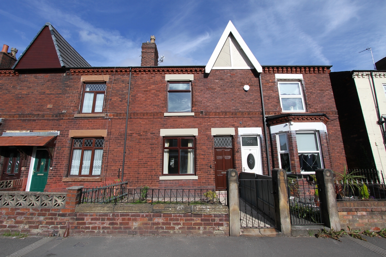 2 bedroom mid terraced house Sold in Wigan - Photograph 1