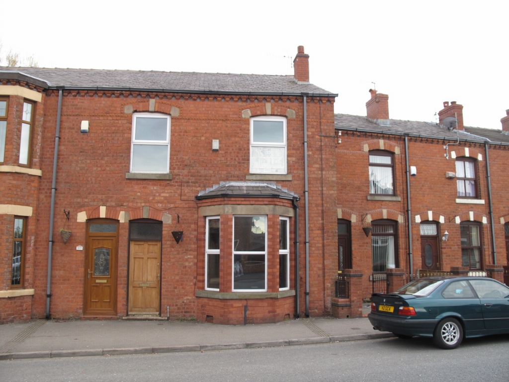 4 bedroom mid terraced house To Let in Wigan - Photograph 1