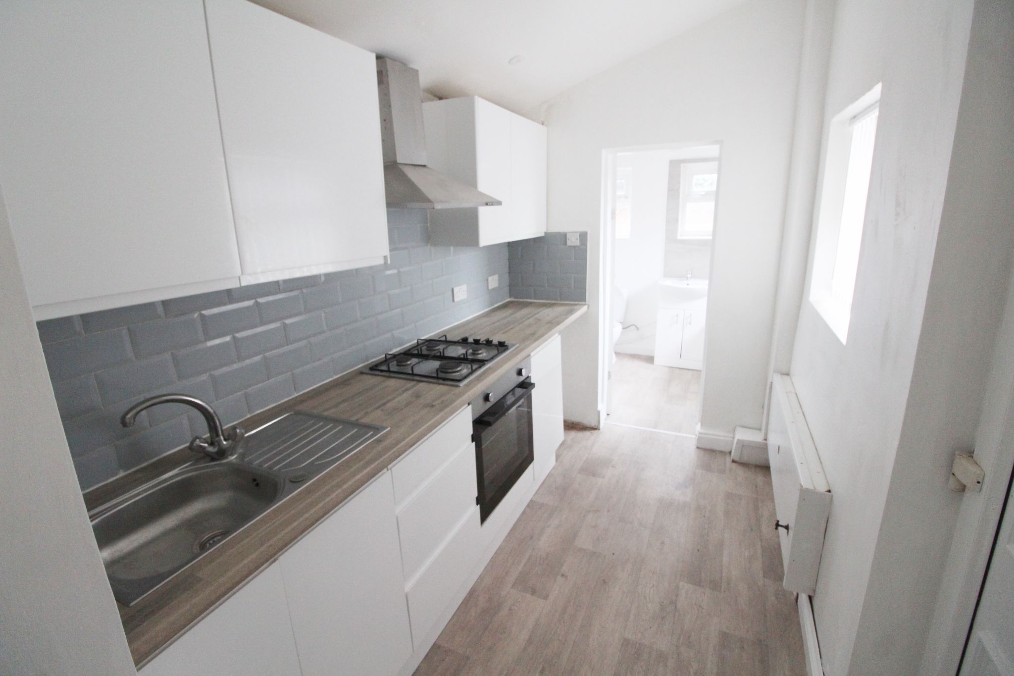 3 bedroom mid terraced house To Let in Wigan - Photograph 6.