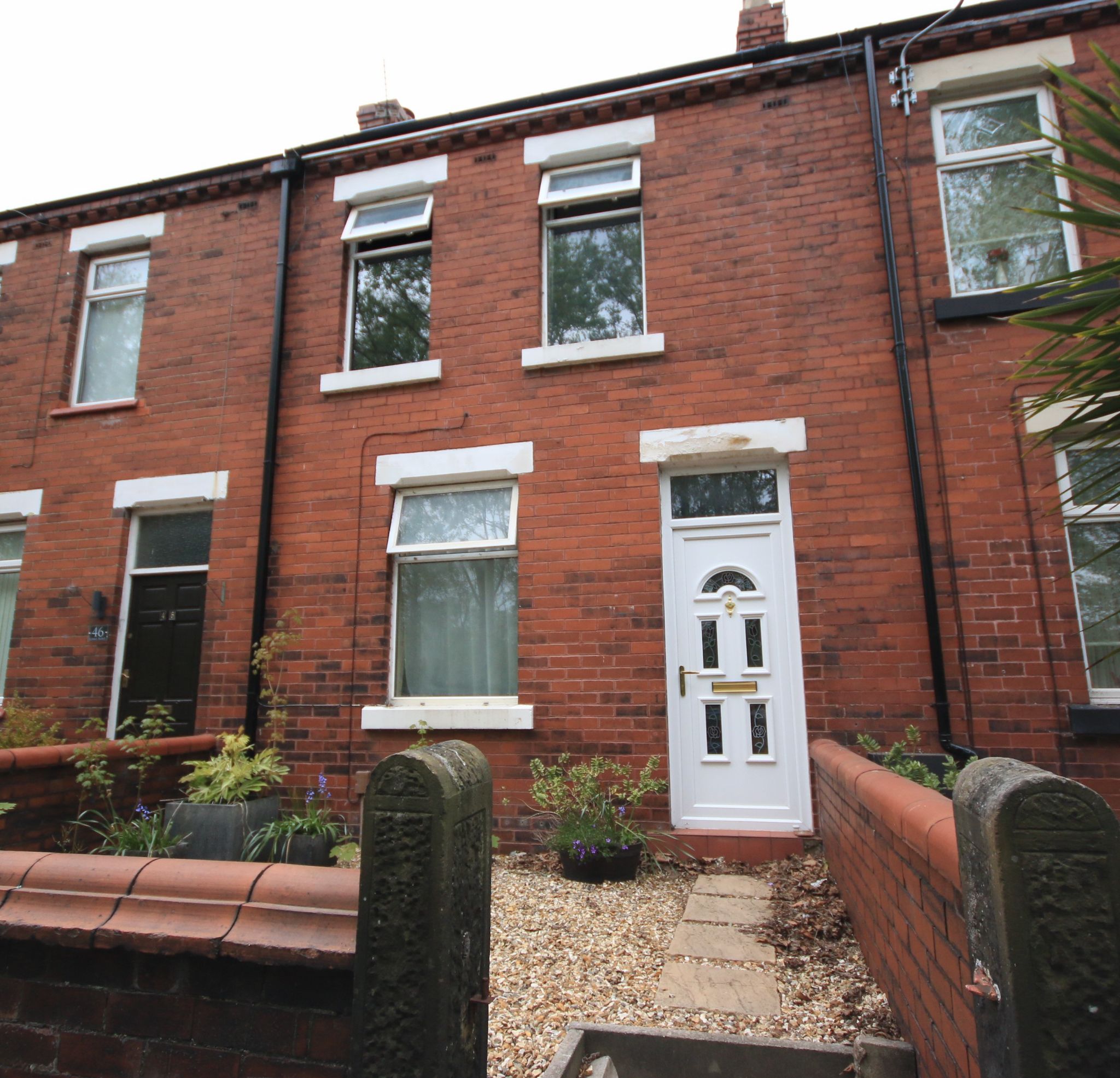 3 bedroom mid terraced house For Sale in Wigan - Photograph 1.