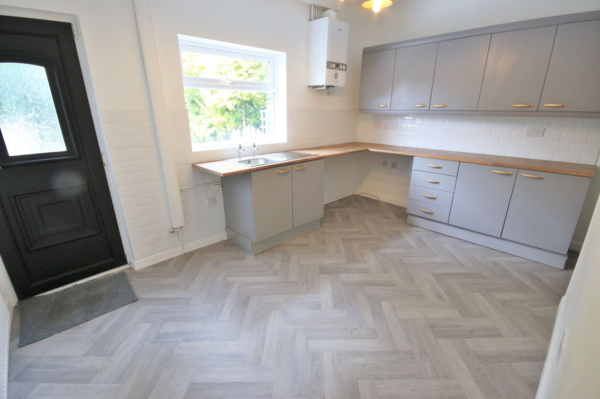 2 bedroom mid terraced house To Let in Wigan - Photograph 3.