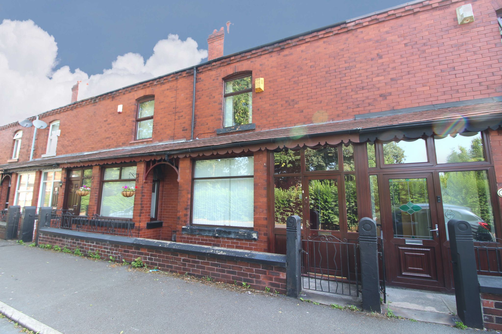 3 bedroom mid terraced house To Let in Wigan - Photograph 1.