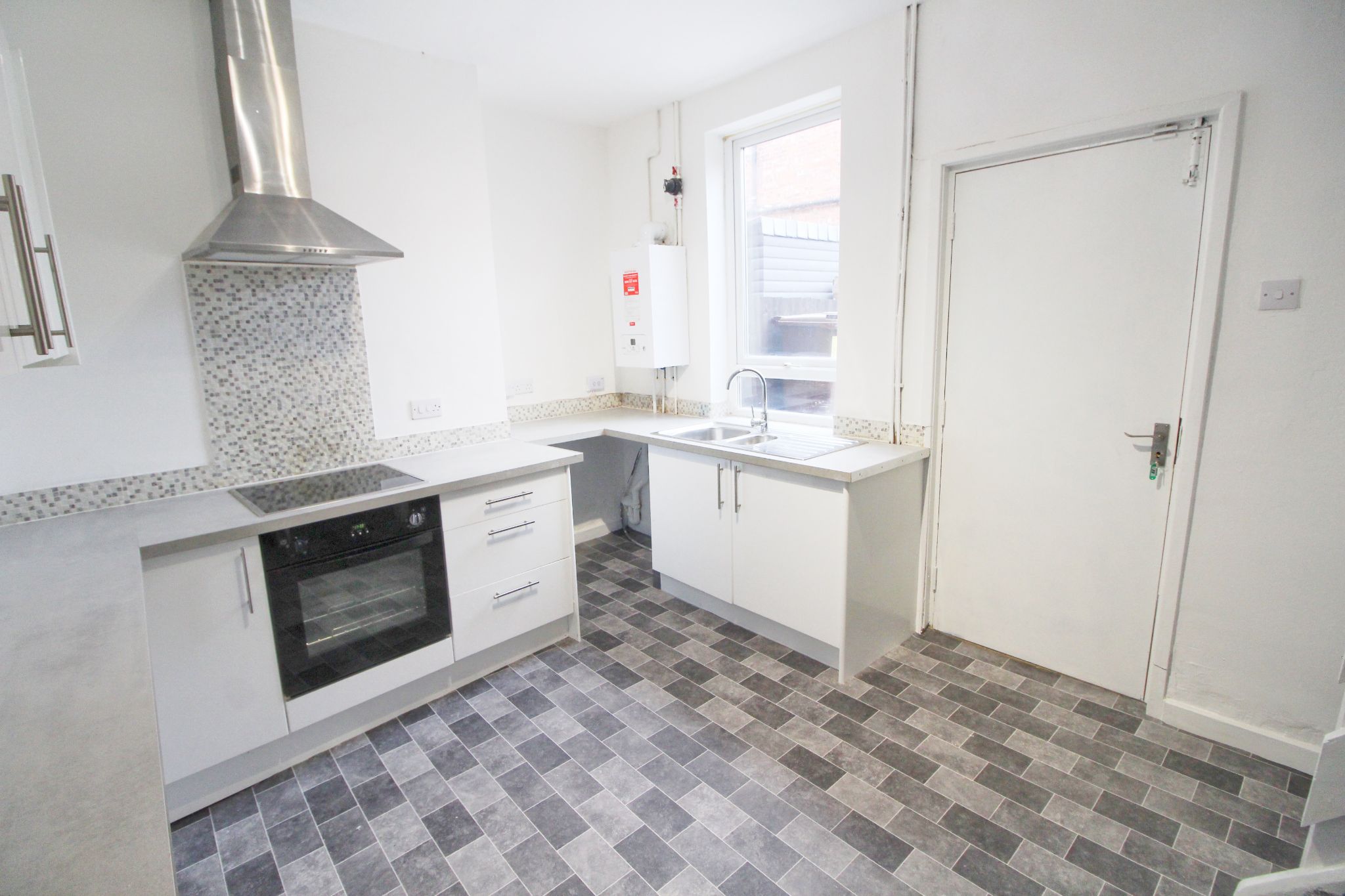 3 bedroom mid terraced house To Let in Wigan - Photograph 3.