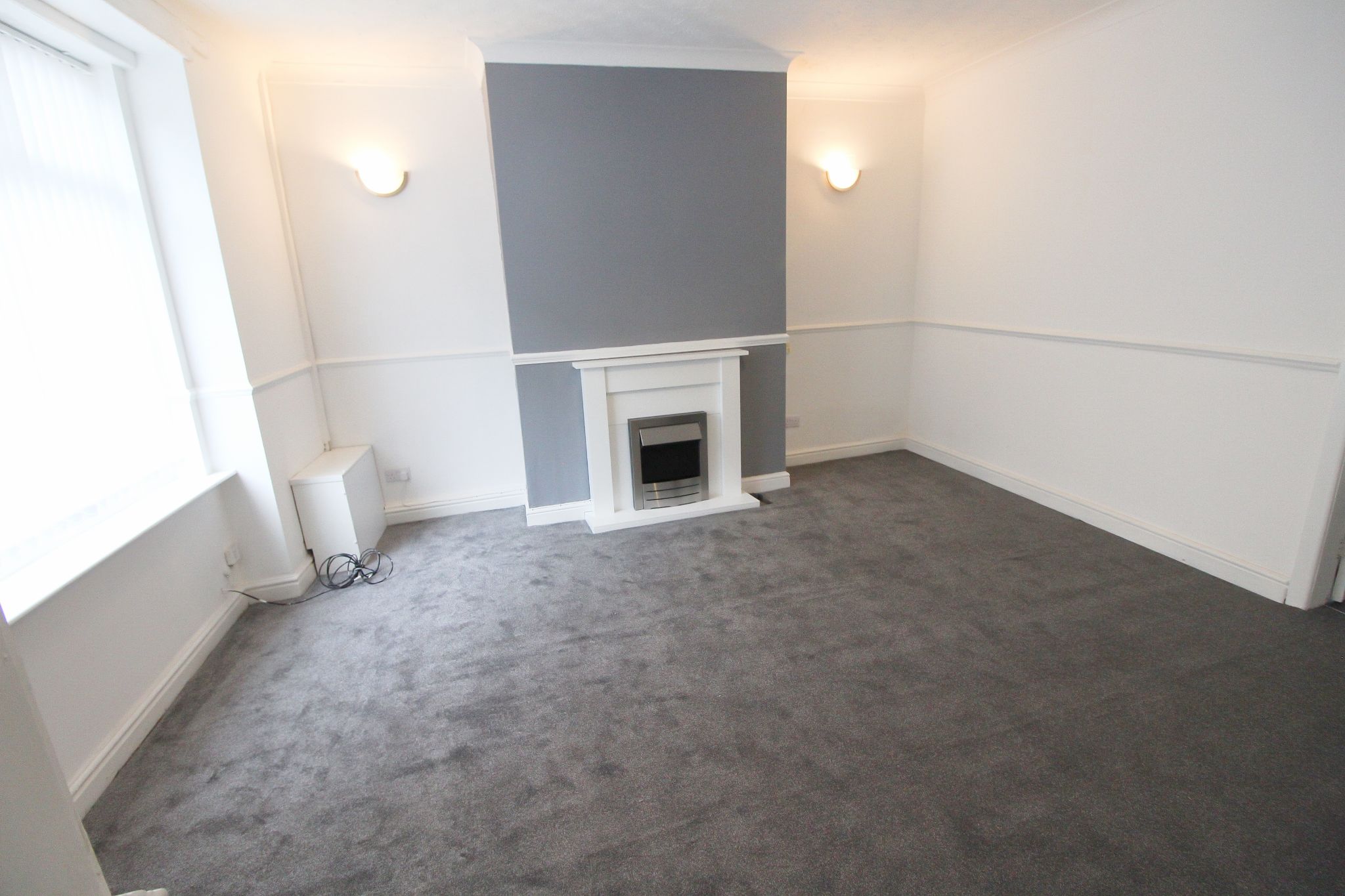 3 bedroom mid terraced house To Let in Wigan - Photograph 2.