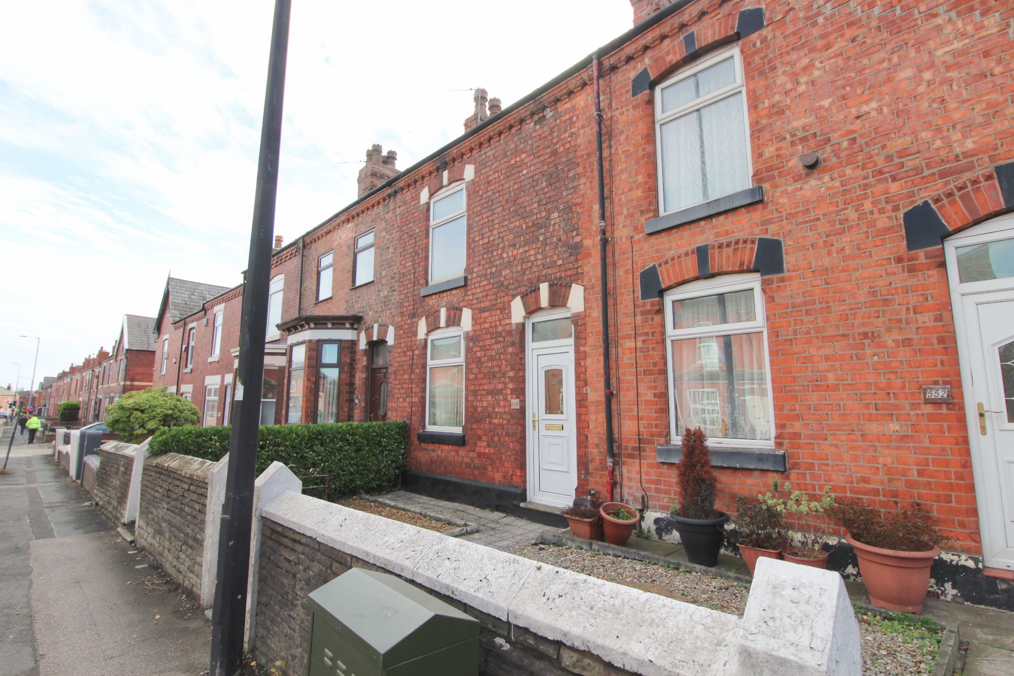 2 bedroom mid terraced house To Let in Wigan - Photograph 1.