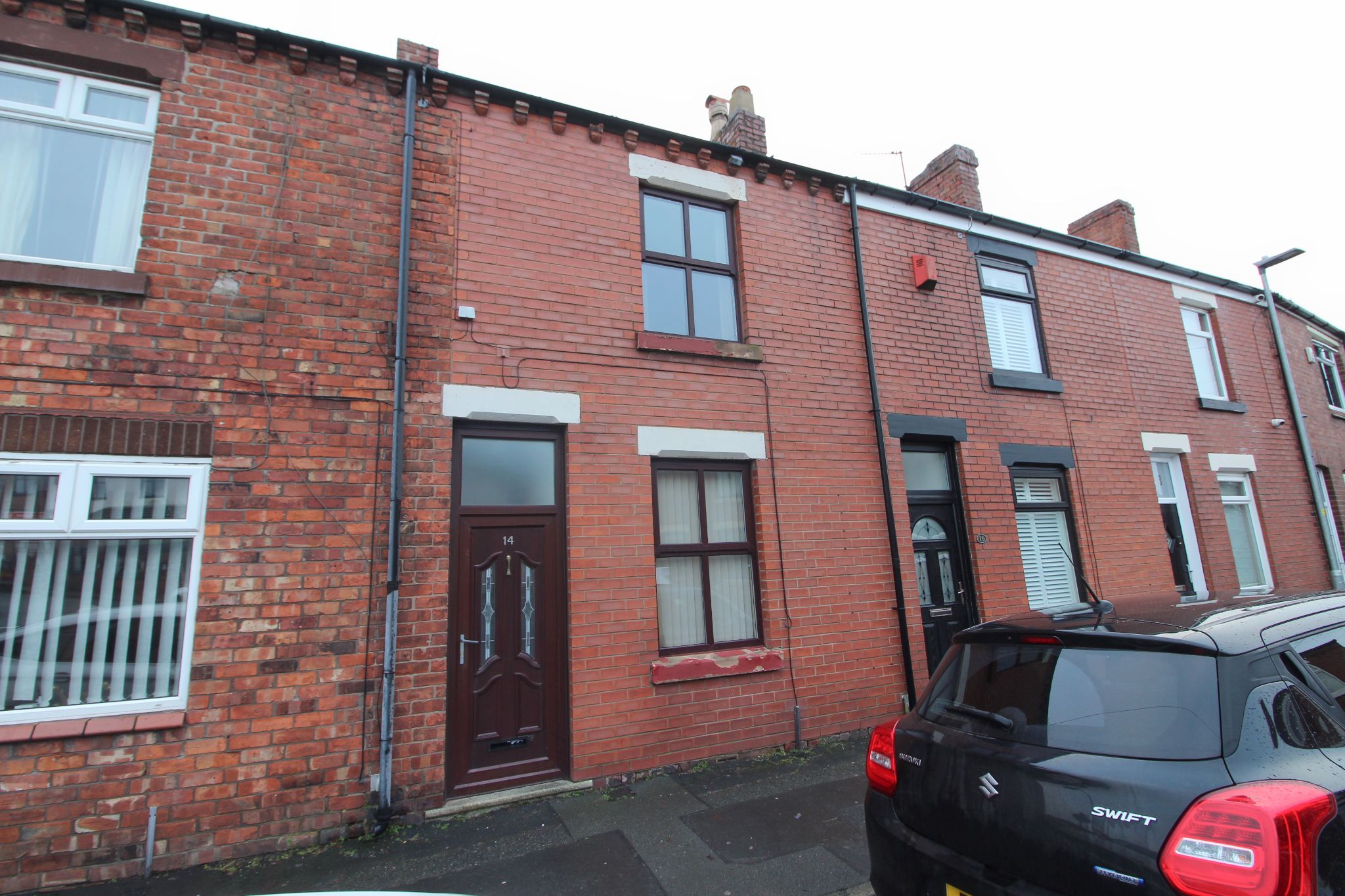 2 bedroom mid terraced house For Sale in Wigan - Photograph 1.