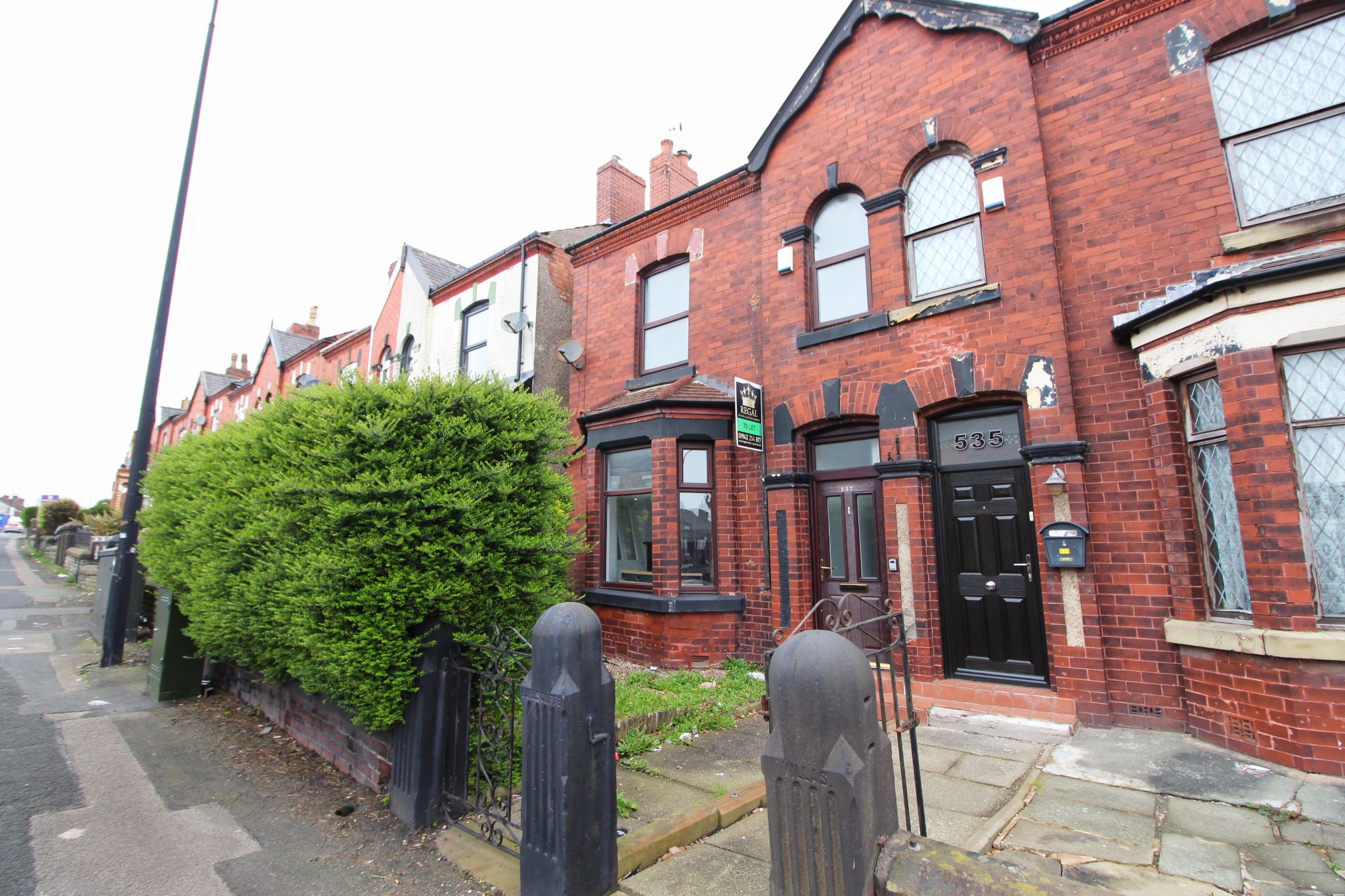 3 bedroom mid terraced house To Let in Wigan - Photograph 1.