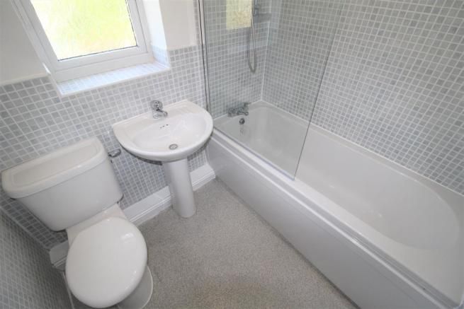 2 bedroom mid terraced house SSTC in Manchester - Photograph 2.