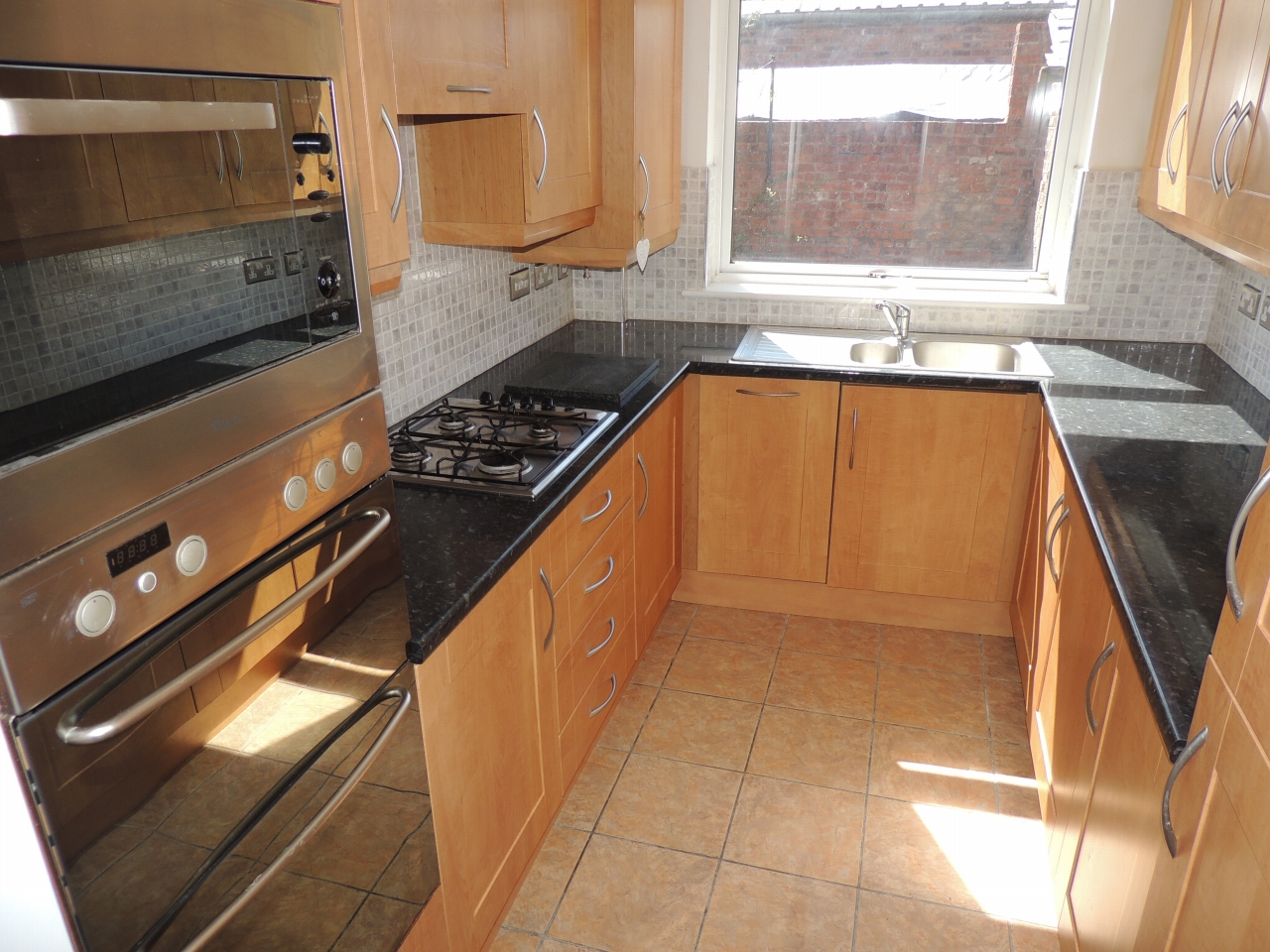 2 bedroom mid terraced house Let in Wigan - Photograph 1