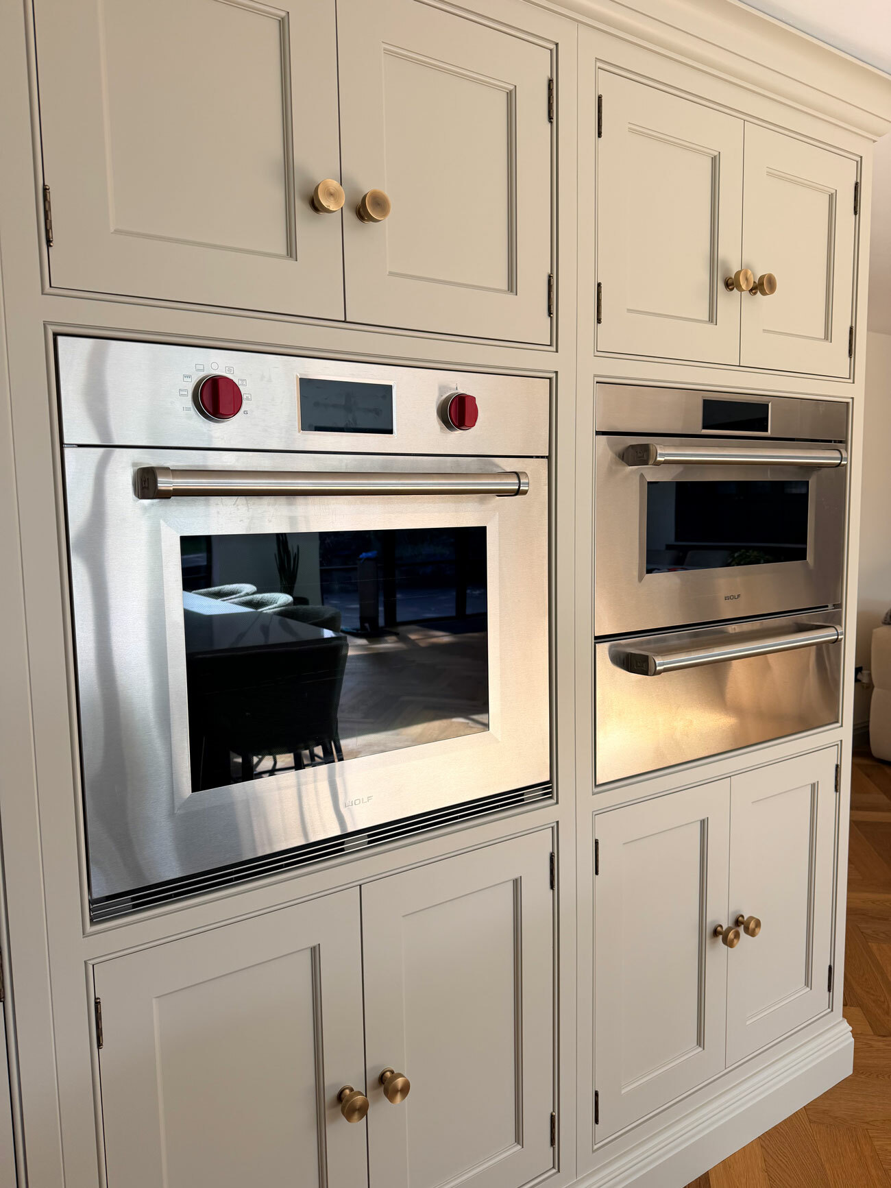 Wolf E Series oven and steam oven integrated into bespoke cabinetry