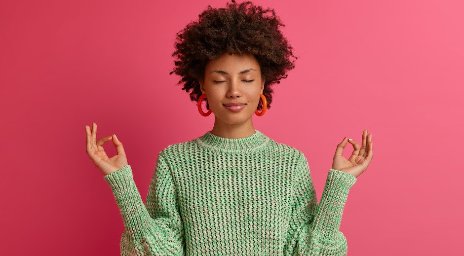 3 no logo.jpg woman holding hands in a zen yoga pose
