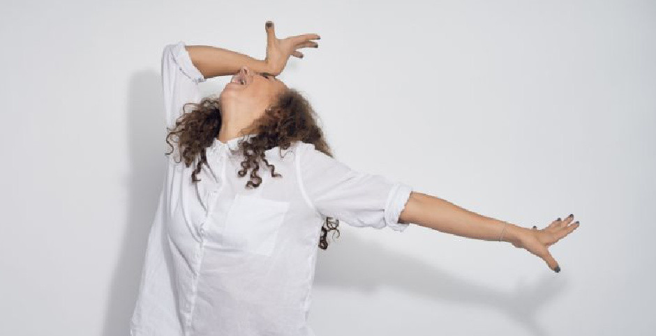 Blog 5.jpg dramatic woman wearing white shirt holding hand to forehad