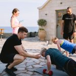 strength training in menopause, press-ups with dumbbells with a coach