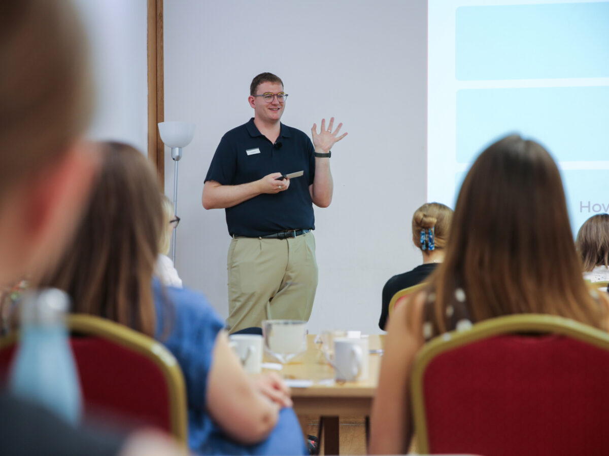 Bookmark CEO presenting to colleagues during a team day workshop.