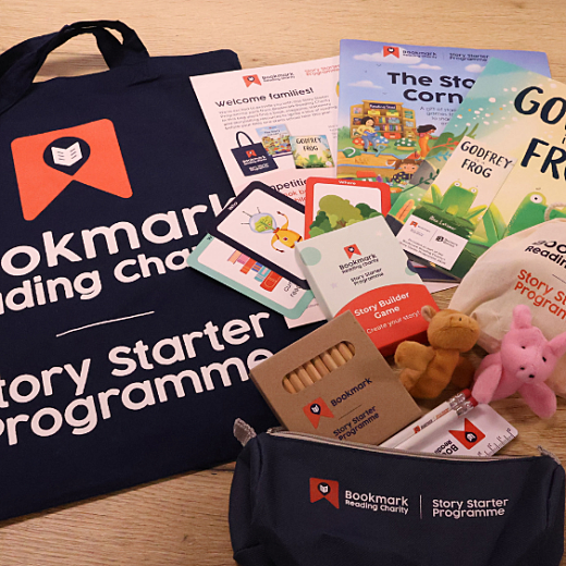 a flat lay of contents of 2026 story starter pack, including books, stationery and activity sheets