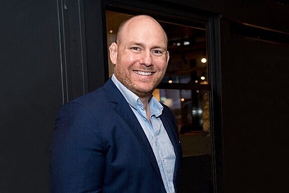 Portrait of author Peter Burns smiling