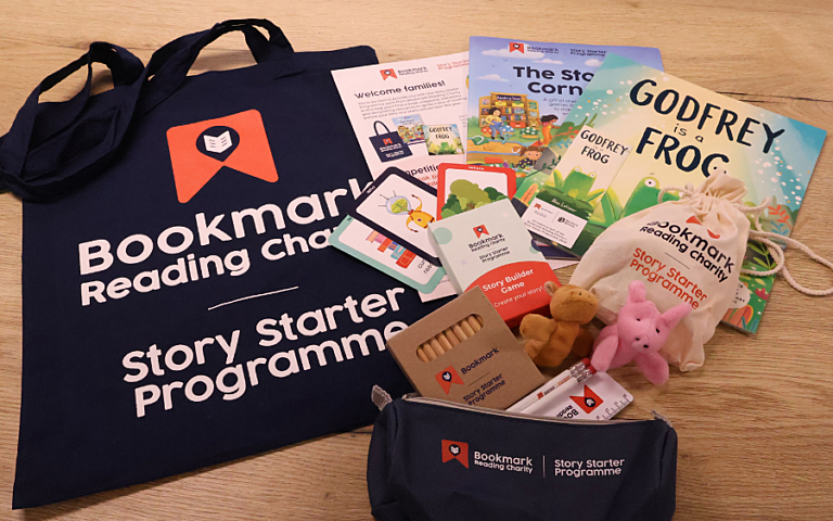 a flat lay of contents of 2026 story starter pack, including books, stationery and activity sheets