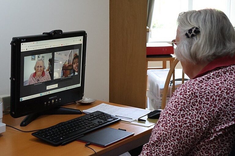 Bookmark Volunteer in an online reading session with her reader on screen.