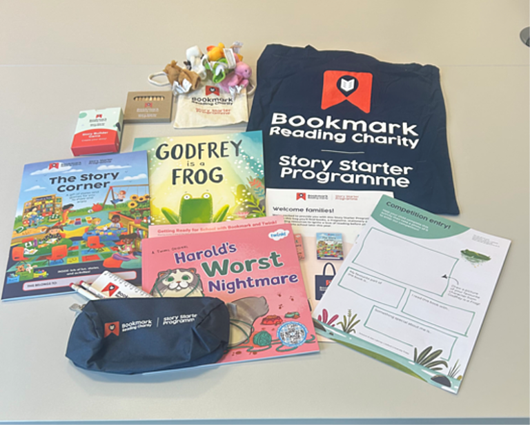 a flat lay of contents of 2026 story starer pack, including books, stationery and activity sheets
