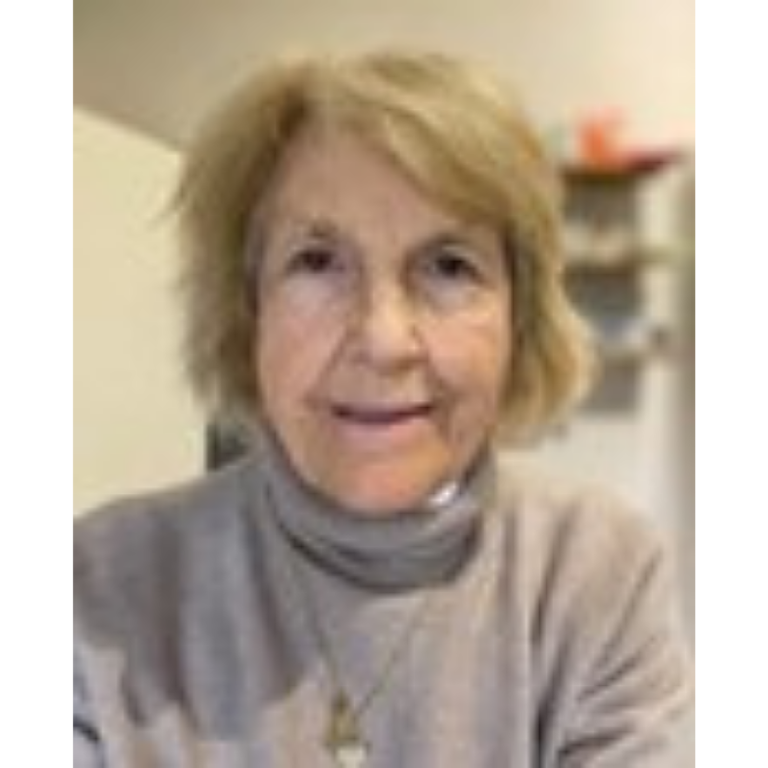 Bookmark volunteer headshot wearing a beige turtleneck jumper.