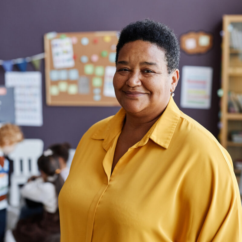 Teacher in yellow shirt