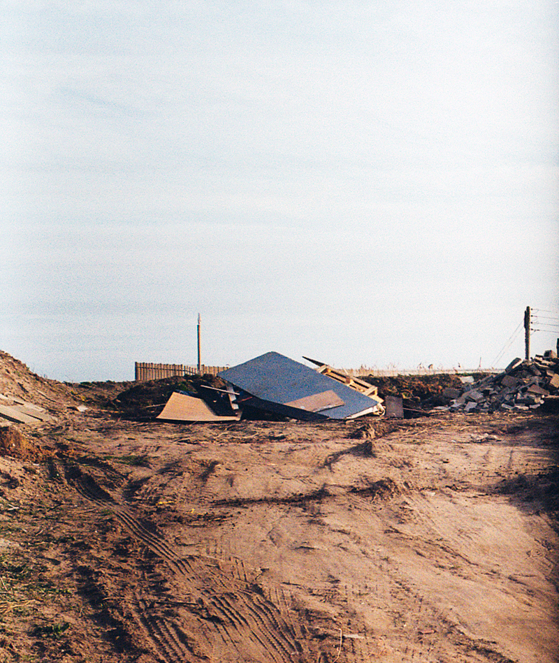 Image of a 2p sign on a beach