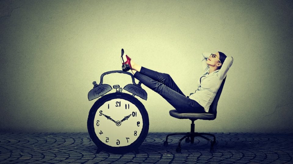 Feet up on a clock