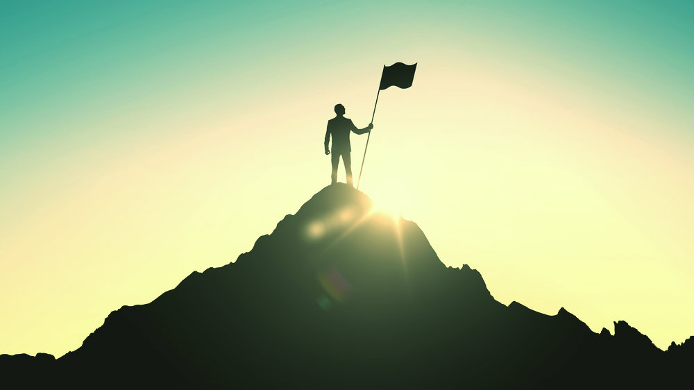 man on the top of a mountain