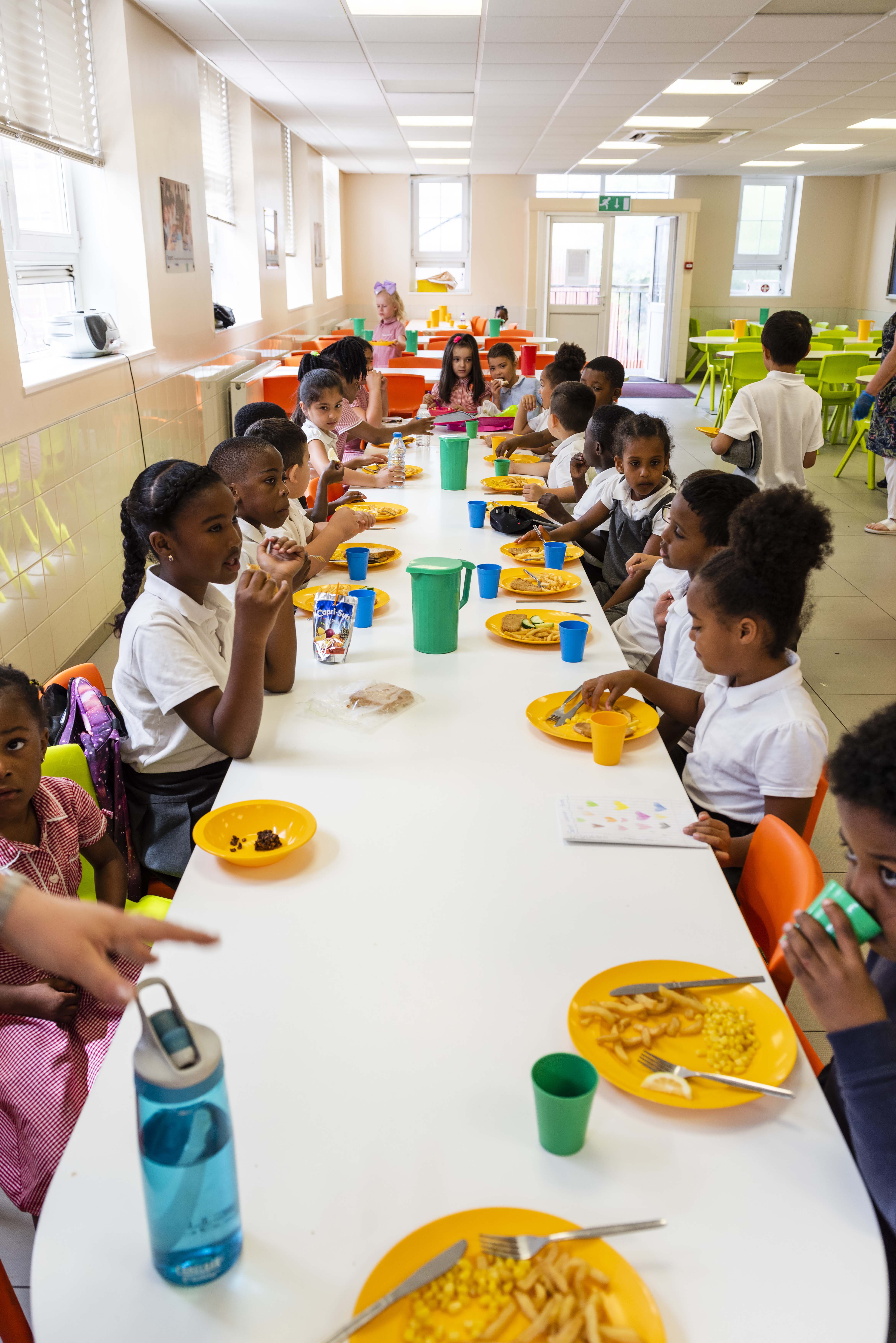 Randal Cremer_lunchtime dinner hall table eating as a group