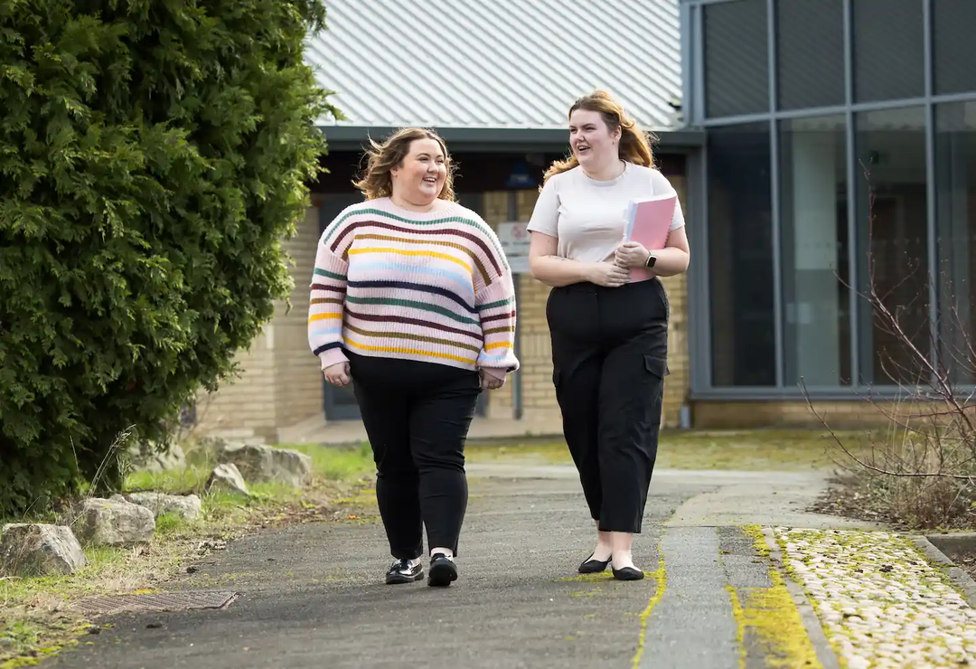 Early career teacher and mentor walking - Ambition Institute